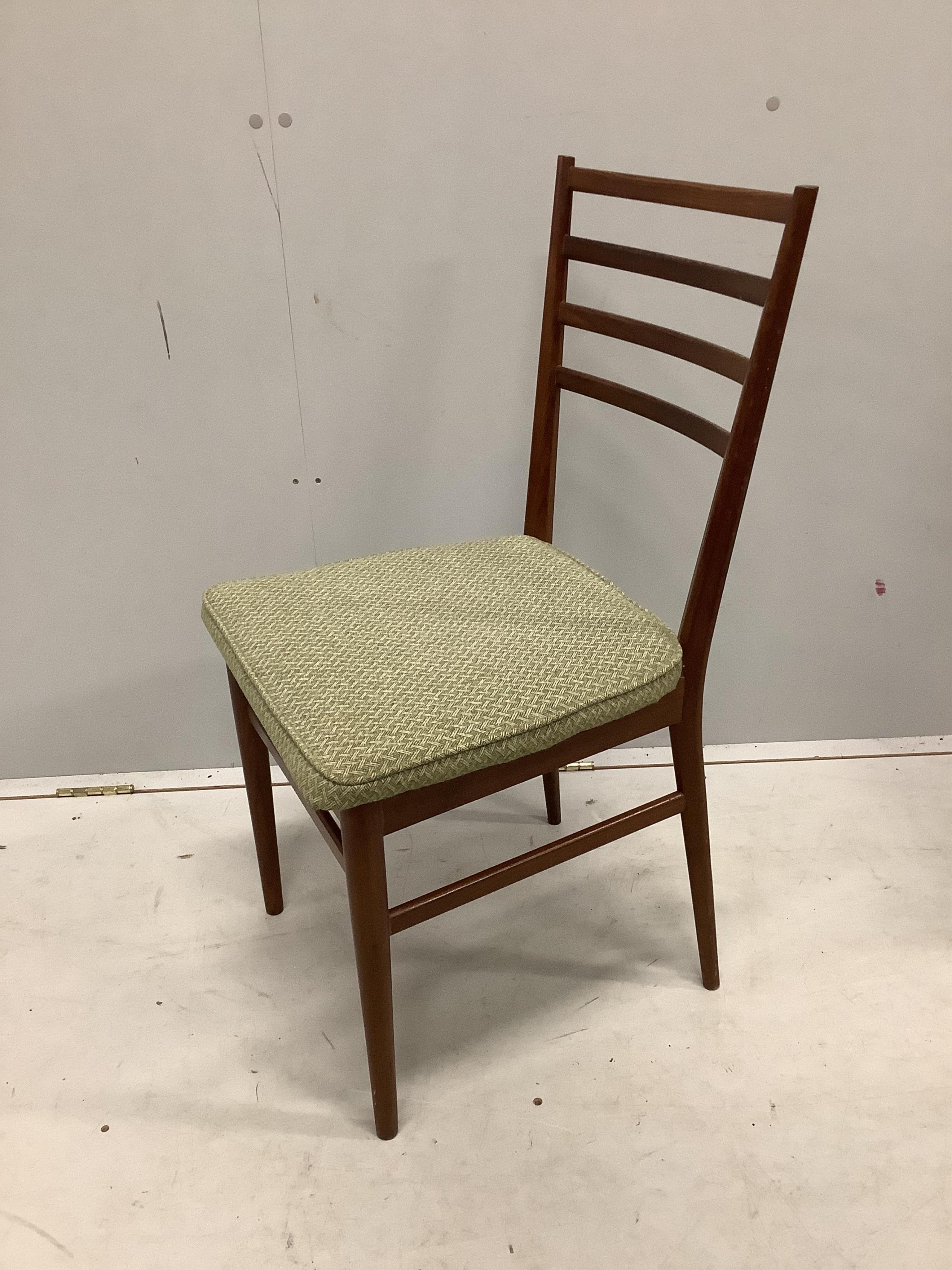 A mid century Meredew Furniture rectangular teak extending dining table and six chairs, table 206cm extended, one spare leaf, depth 84cm, height 75cm. Condition - fair.